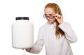 female scientist inspecting a plain jar of collagen powder