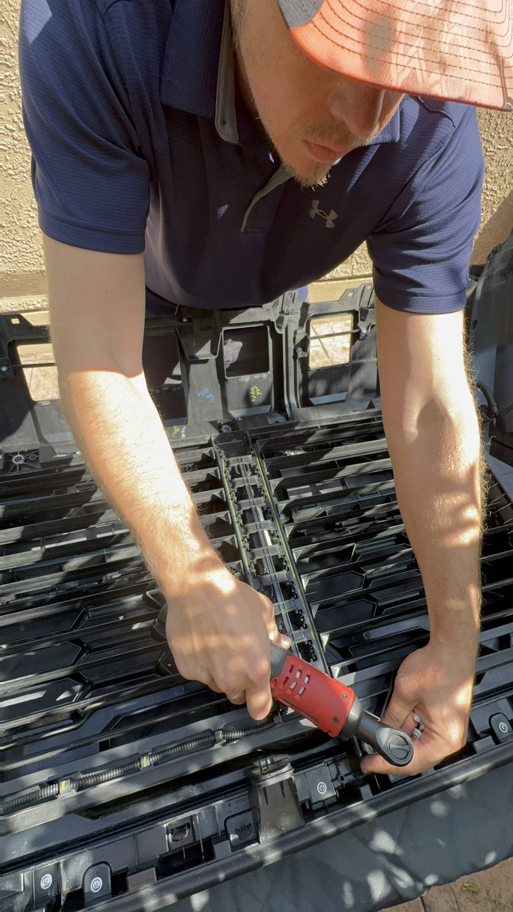 mike owner of m&R automotive led light bars behind the grille on toyota tacoma