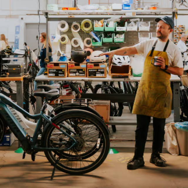 mechanic looking at an electric bike