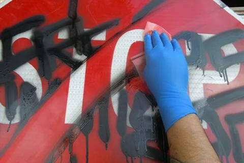 graffiti removal from street sign