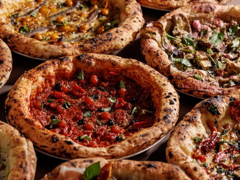 Image may contain: Food, Food Presentation, Pizza, Meat, Pork, and Bread