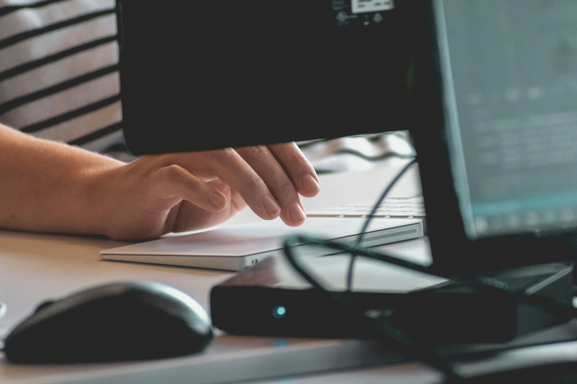 A close up of a girl working on a computer ot upload a post to Reddit at the best time