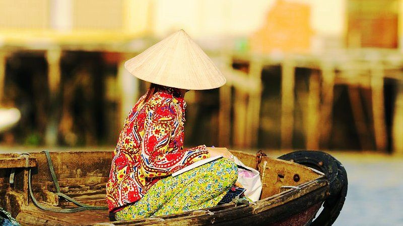 Lady on a boat, Mekong delta, Thailand 