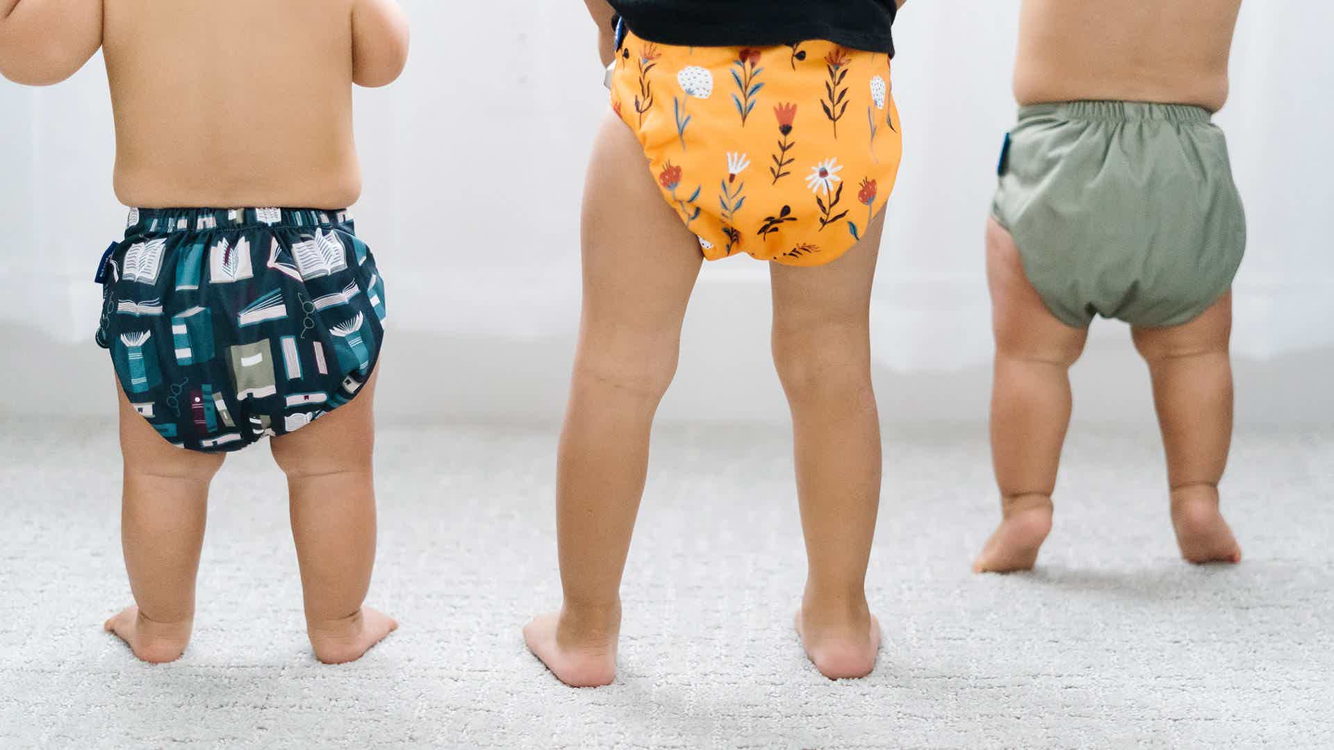 modern reusable cloth diapers in playful and bold prints and colors kinder cloth diaper co