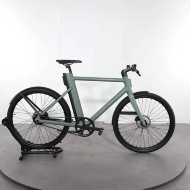A green Cowboy Electric Bike cruiser