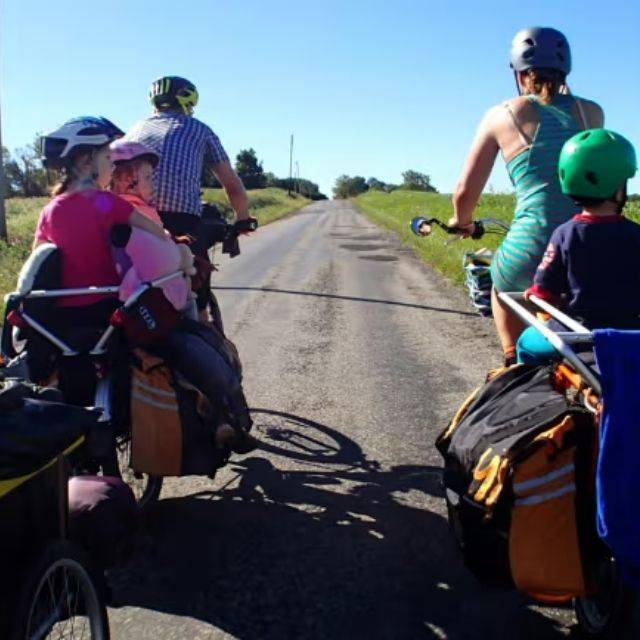Family on 2 cargo ebikes