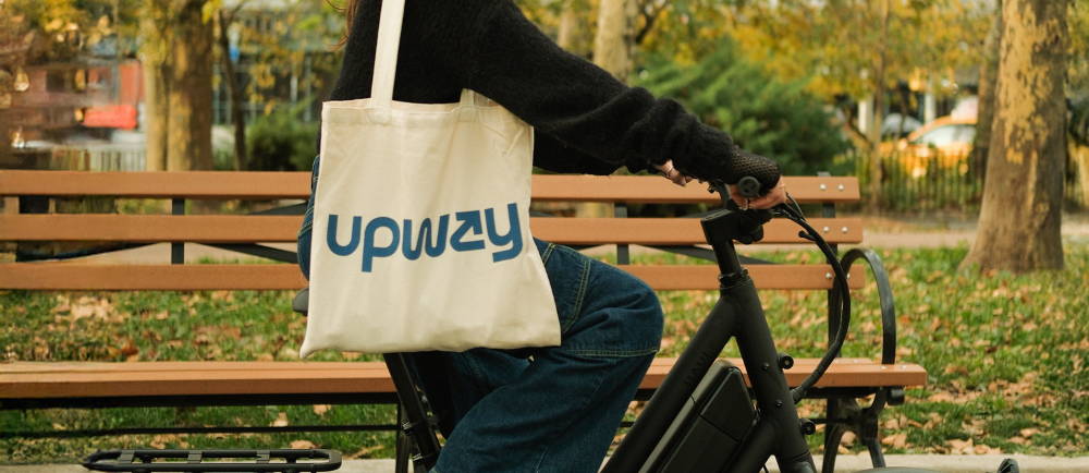A person on an e-Bike with an Upway Bag