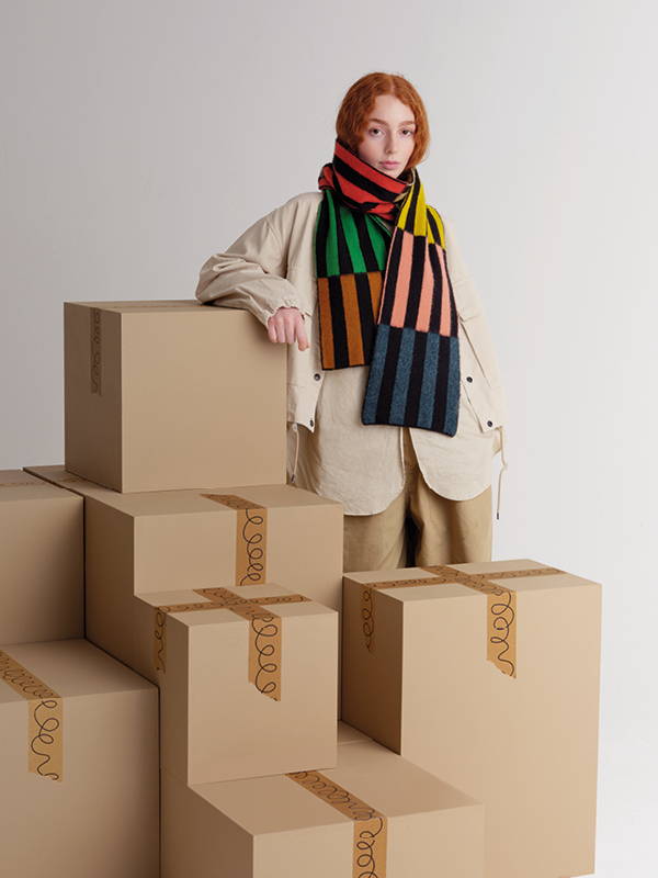 model wears brushed multicolour rectangles scarf