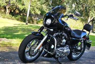 2013 HARLEY-DAVIDSON XL1200C CUSTOM (VIVID BLACK) motorcycle for rent near Orlando, FL