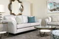 Transitional Chloe sofa with timber undercarriage in beige neutral fabric with spa green cushions and tivoli coffee tables