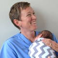 NICU RN Nurse Trish Holding Preemie Baby Swaddled in pink blanket