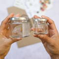 Two glass spice jars labeled 'Gneiss Spice' of different sizes