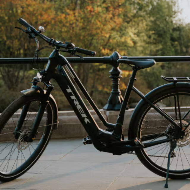 a trek allant electric bike in a park by the water