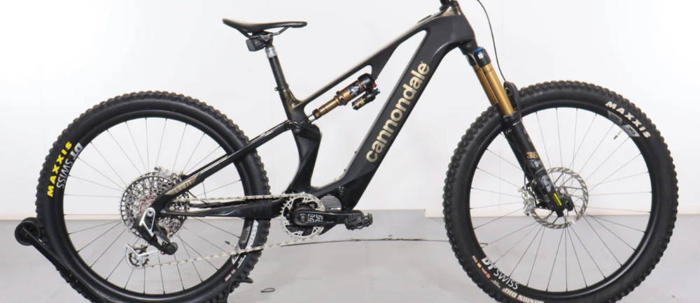 a dark blue Cannondale Moterra Neo SL 1 full suspension electric mountain bike