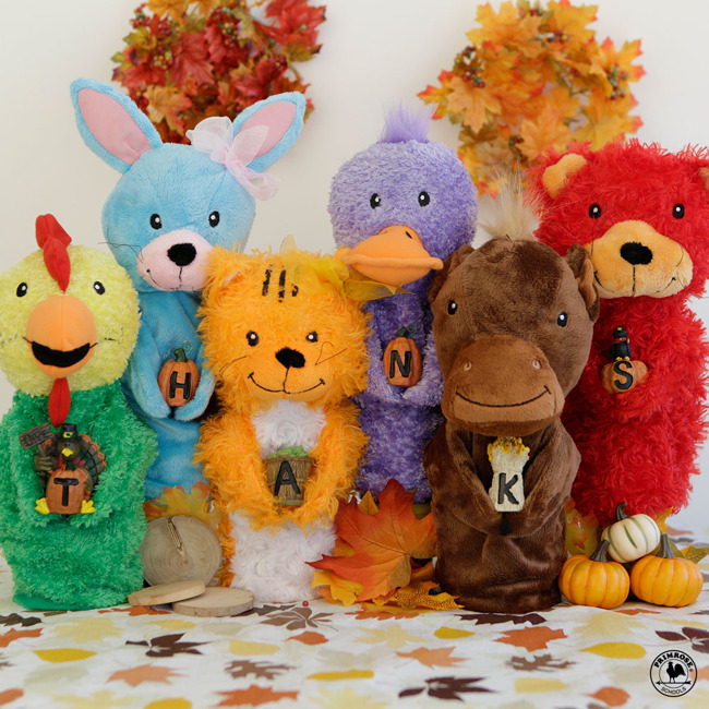 Primrose puppets hold tiny pumpkins that spell out the word "Thanks"