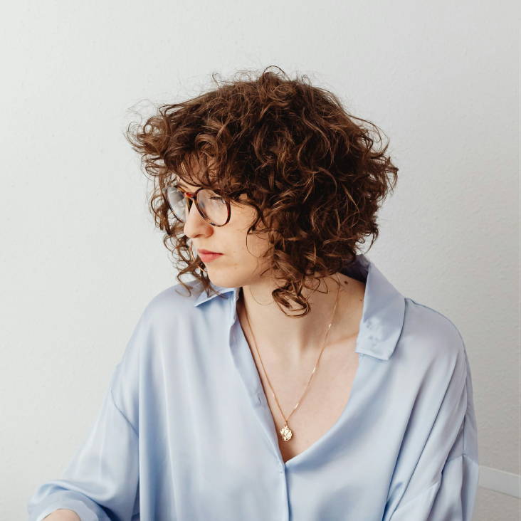 woman with messy layered curls