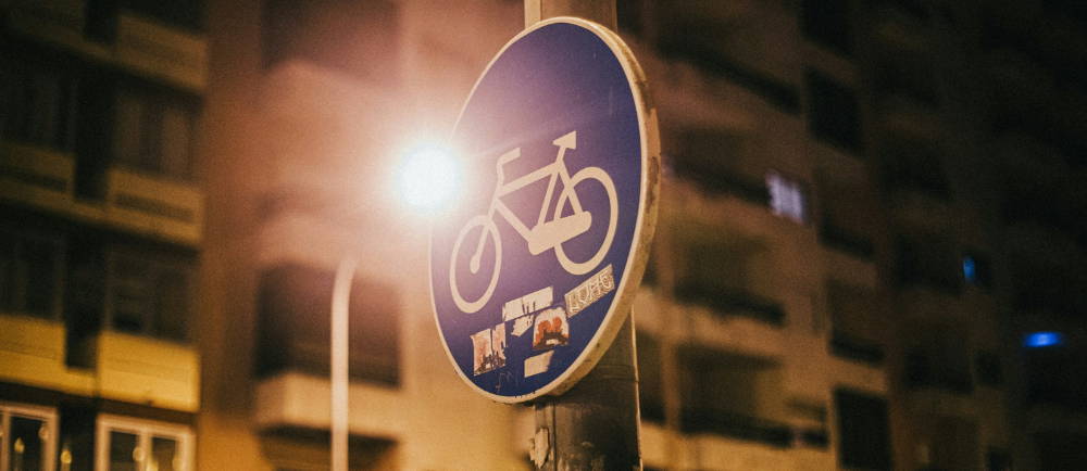 bicycle street sign at night