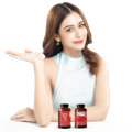 beautiful lady with two bottle of krill oil singapore in front of her