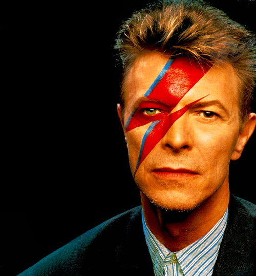Portrait of David Bowie with a bight colored lightning bolt going down his face.
