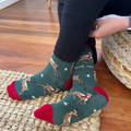 Polar bear socks on coastal pebbles