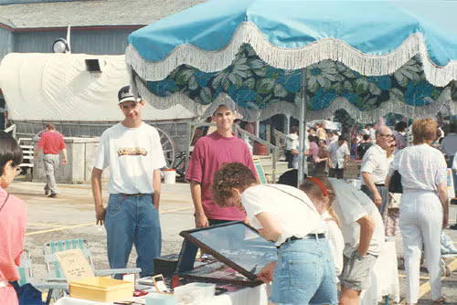 1990s photo of the early flea market setup with the original sign