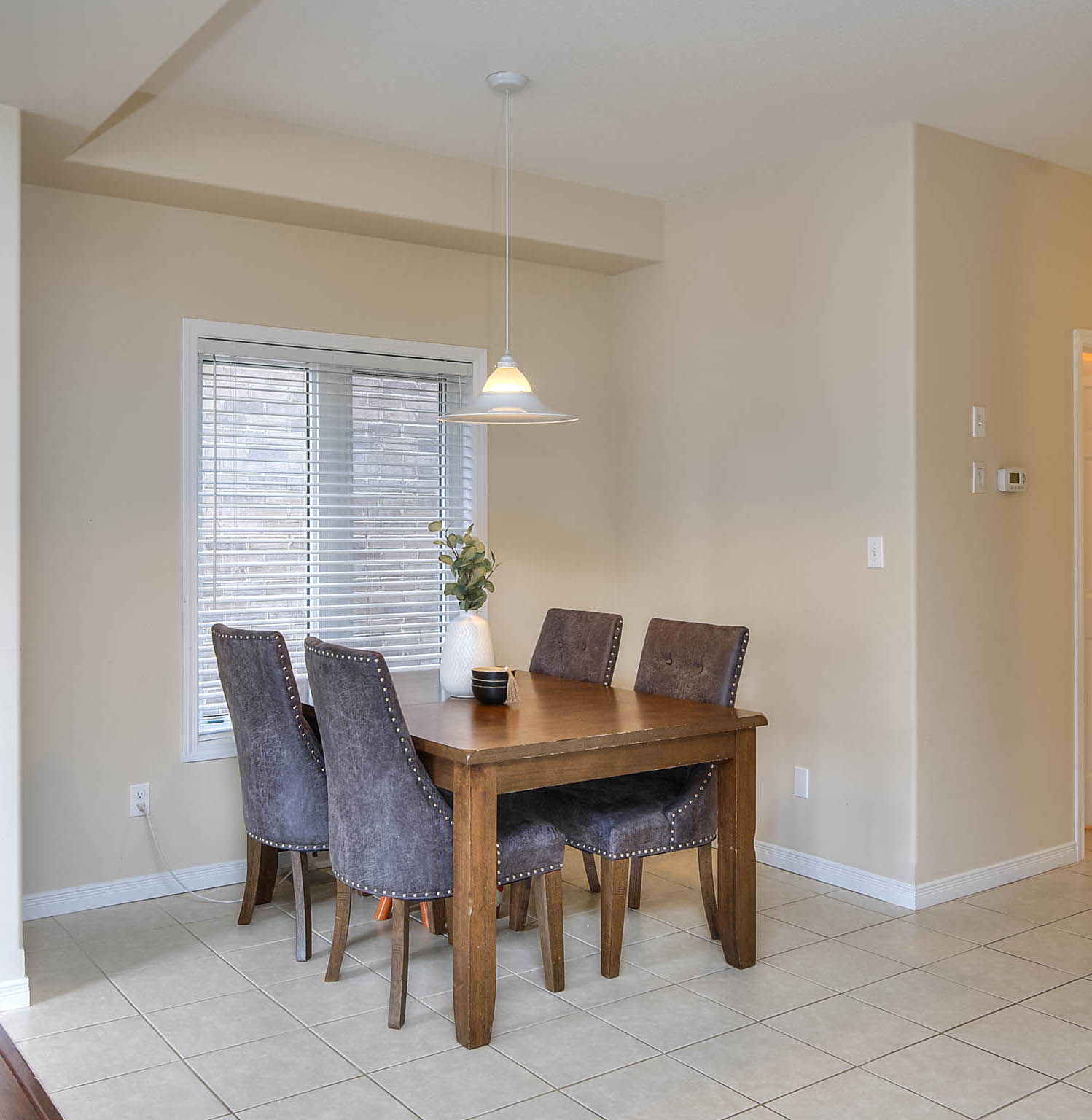 tiled dining area featuring natural light