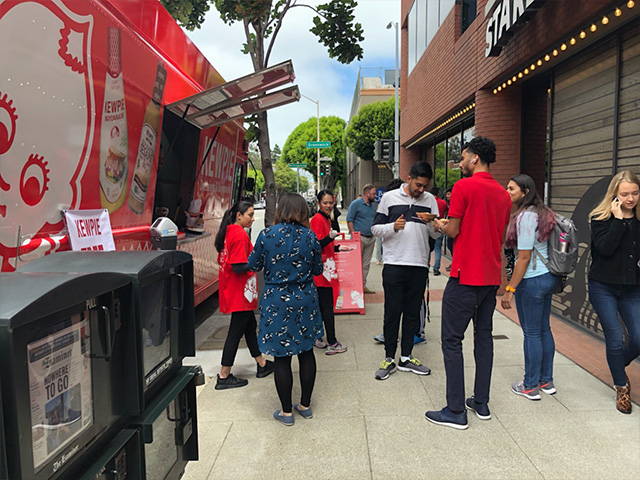 Young people hanging out at the Kewpie food truck