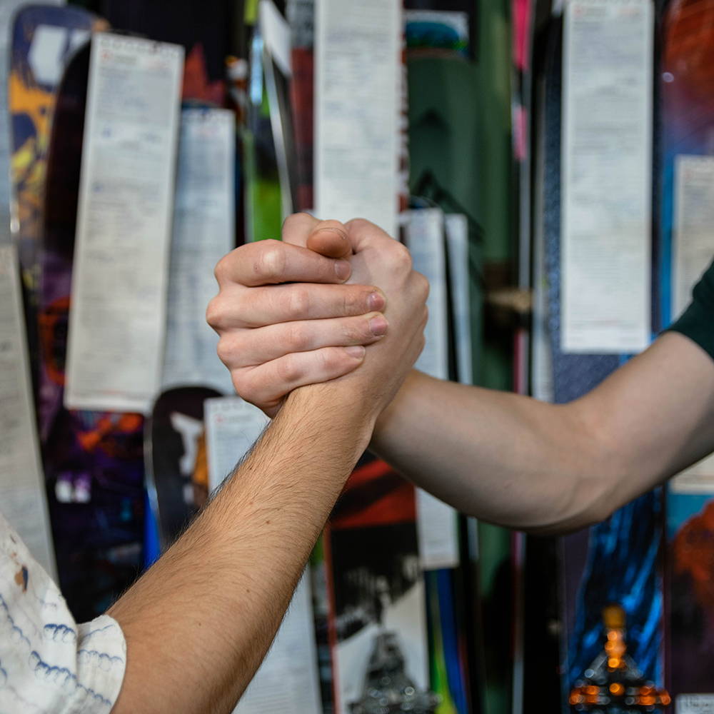 Two people shaking hands.