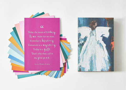 an open book with a colorful angel painting on the left page and a  preview of the text on the right page