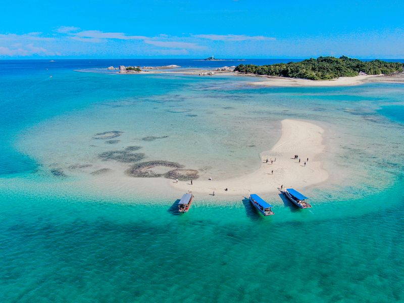 Image may contain: Nature, Outdoors, Sea, Water, Coast, Shoreline, Boat, Transportation, Vehicle, and Aerial View