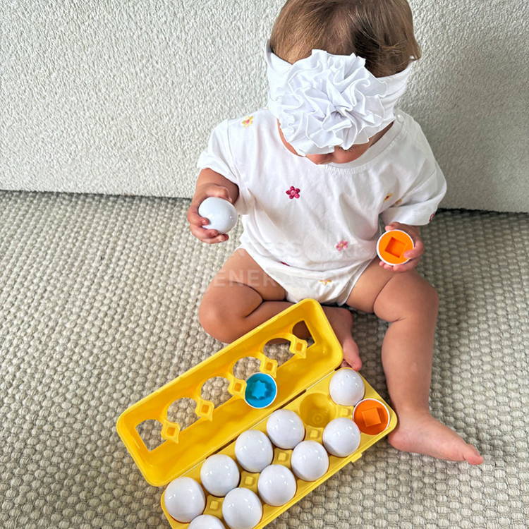 A colorful educational toy for kids with eggs in a carton and different geometric shapes.