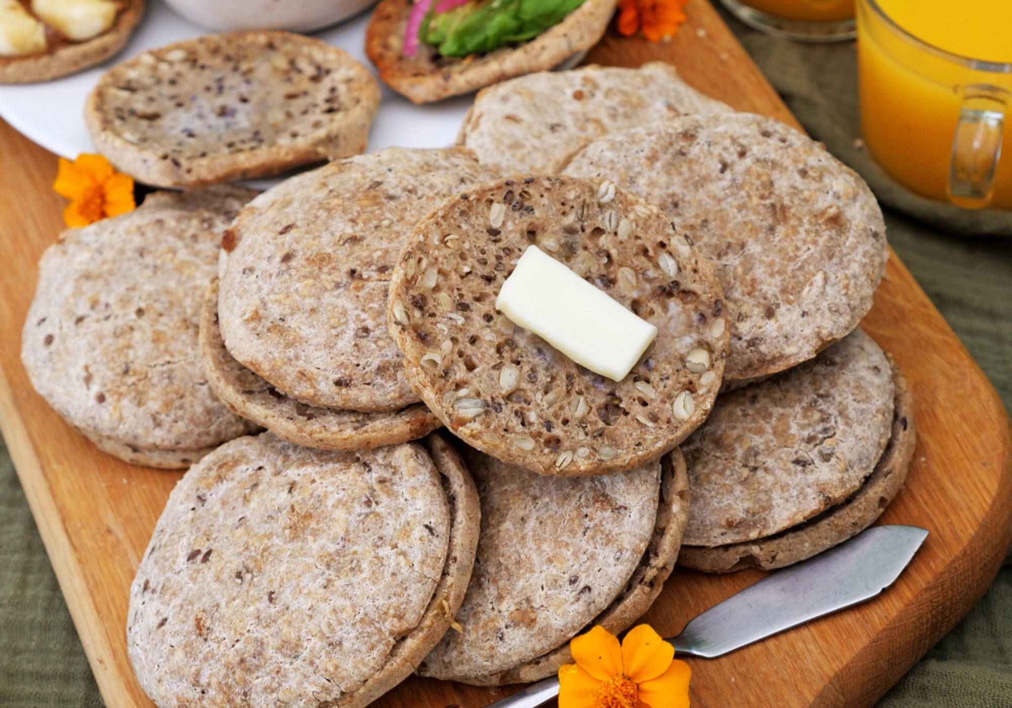 Close-up of a sliced PACHA English Muffin showing the texture of sprouted buckwheat.