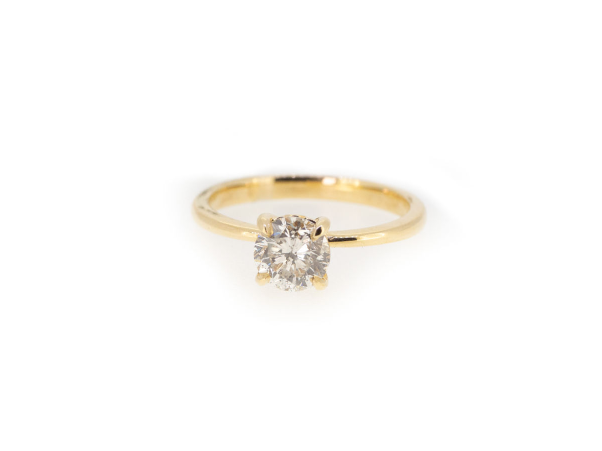 Yellow gold solitaire engagement ring
