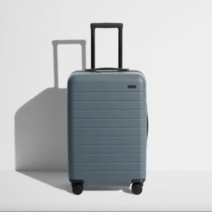 The Bigger Carry-On suitcase color: Coast Blue | Away