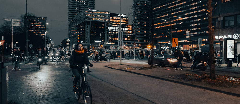 a woman riding an electric bike in the city