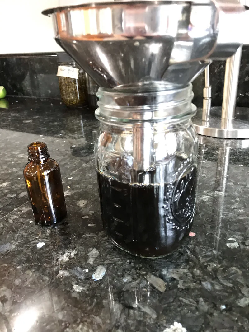 Straining herbal extract for bottling