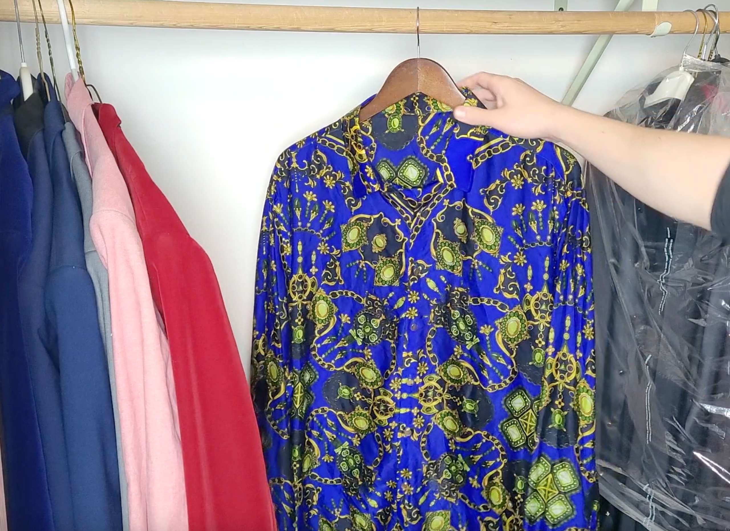 photo of satin clothes air drying in a closet