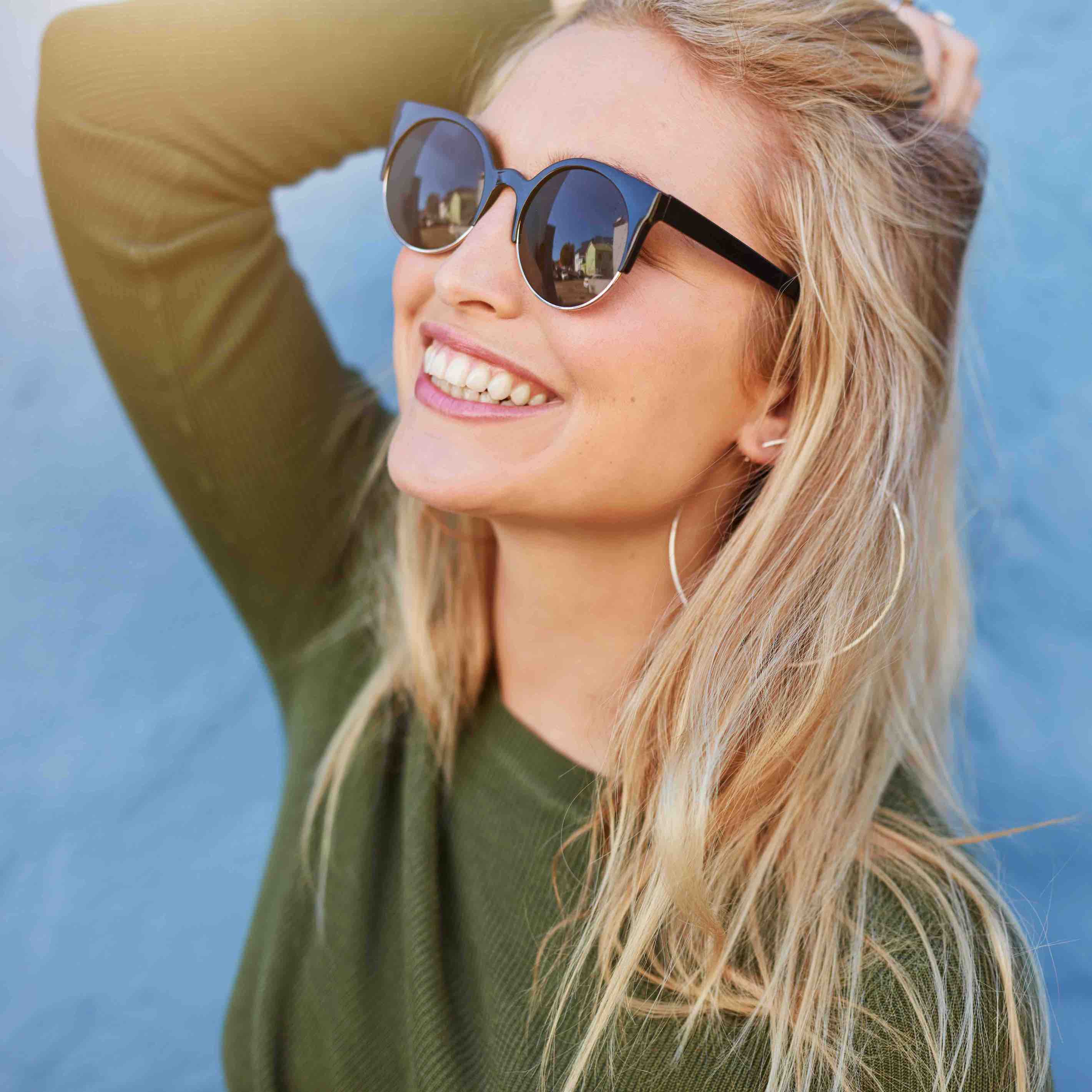 Woman in sunglasses smiling