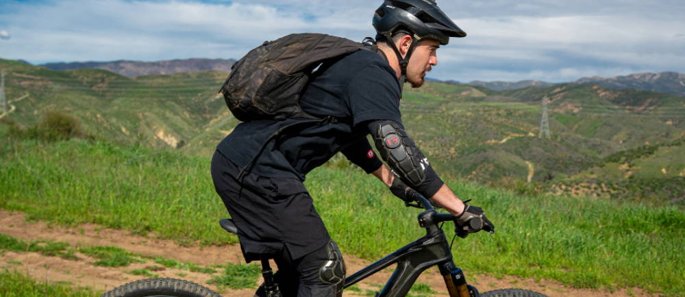A man riding an electric mountain bike in the mountains above los angeles