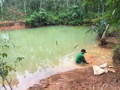 artisanal diamond miner panning for natural diamonds in kalimantan Indonesia
