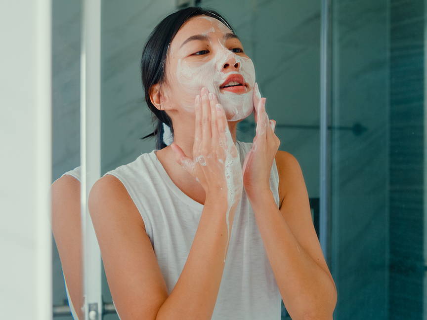 woman washing her face
