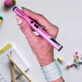 female-holding-pink-pain-pen-stun-gun