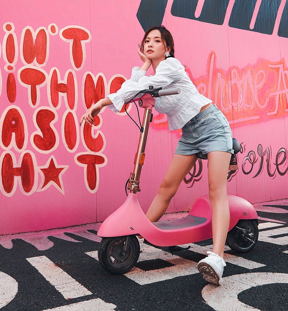 ea10 escooter girl riding pink electric scooter with seat