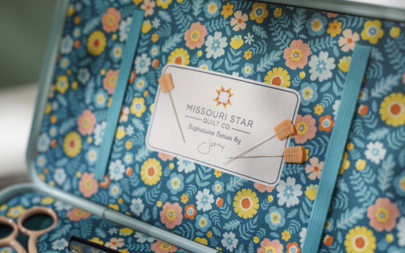 quilting pins magnetically attach to the inside top of the toolbox!