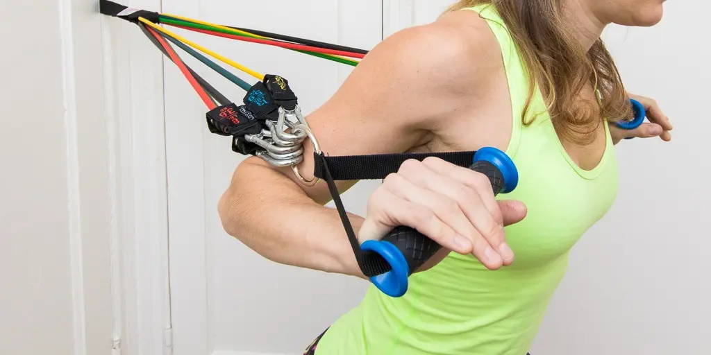 athlete training at home with door anchor