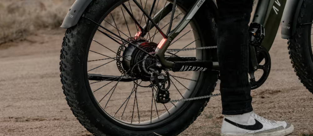 Rider on Aventon electric bike with rear lights