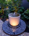 Warm garden spike lighting highlights foliage and textures, creating depth and calm outdoor ambience by Havit.