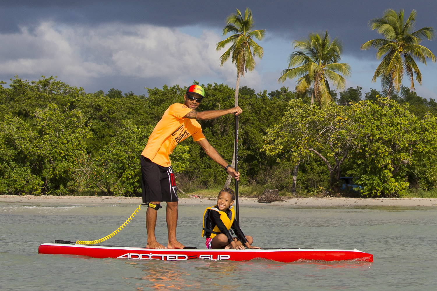 425 pro Air Sup Board: A man paddling with a child