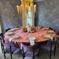 round velvet tablecloth with pumpkins in the center of the table