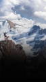 Woman and black dog at summit with sentiero dog leash